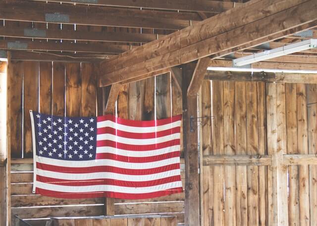 flag hanging in a barn